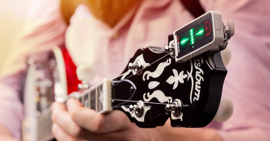 Tune a banjo with an electronic tuner