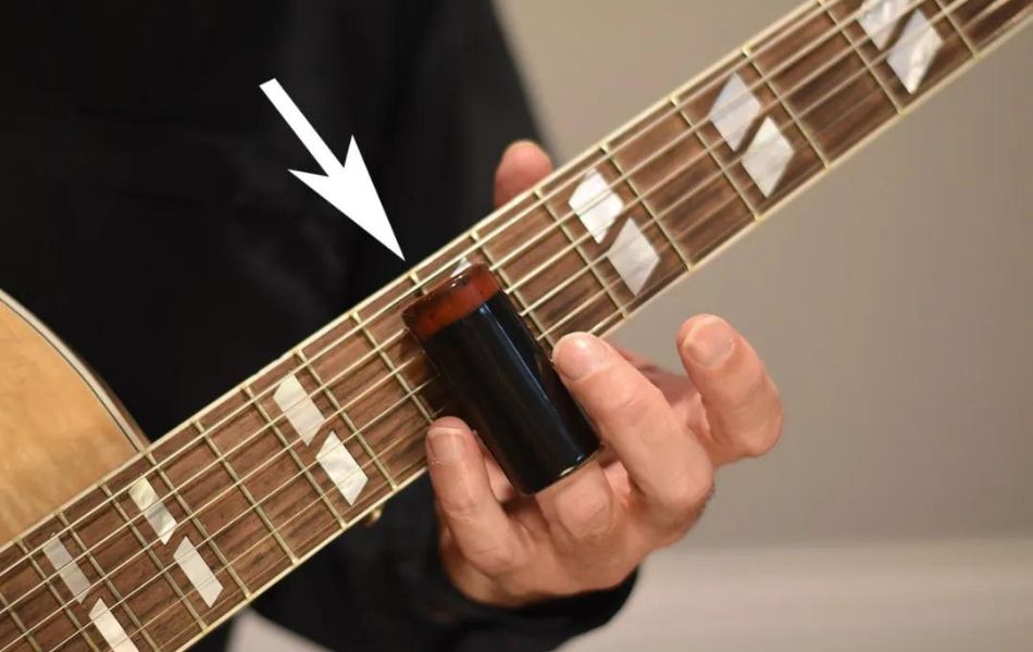 Guitar slide is a technique playing guitar