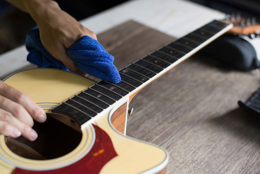 Clean your acoustic guitar